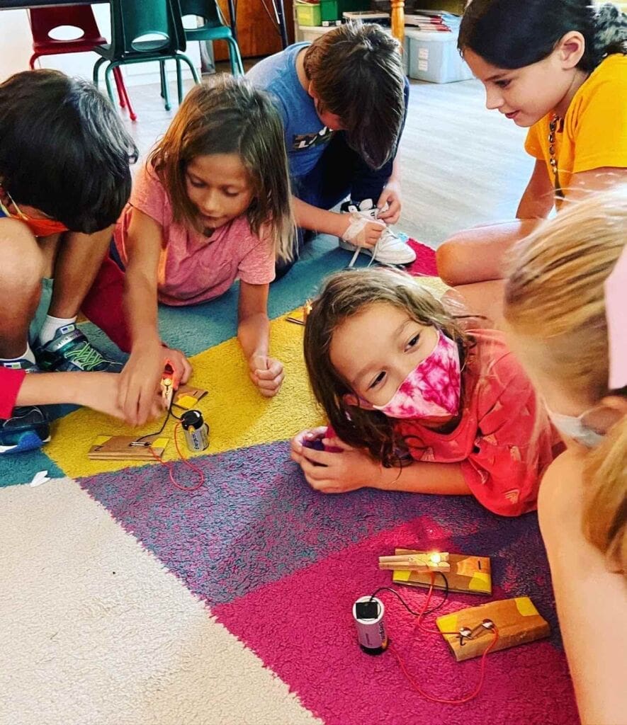 Children learning about electricity together