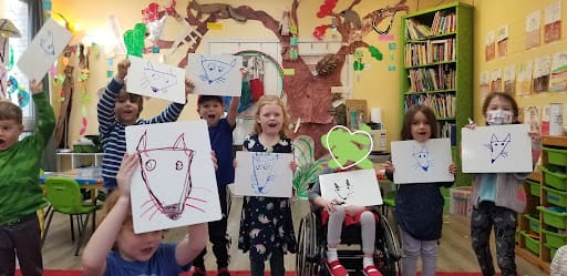 Children display drawings of fox at part time school.